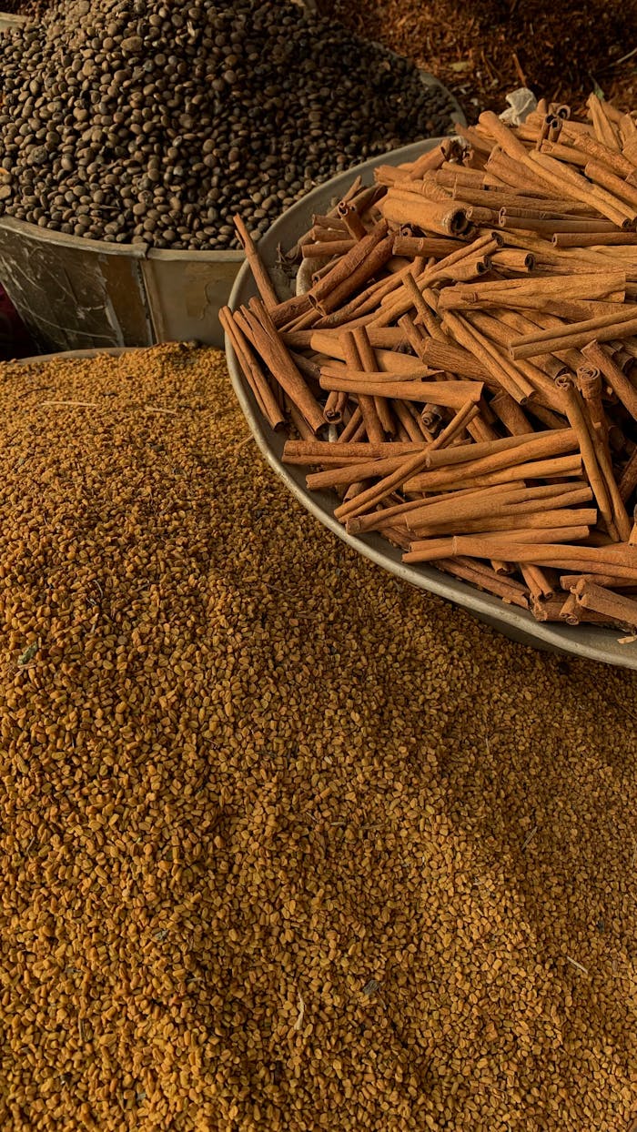 spice-market-display-with-cinnamon-and-seeds-31665461